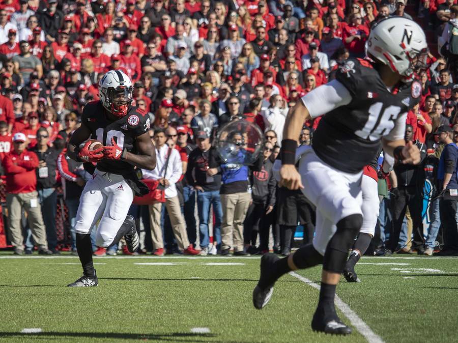 JD Spielman prepares to throw to QB Noah Vedral