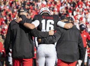 Noah Vedral is helped off the field
