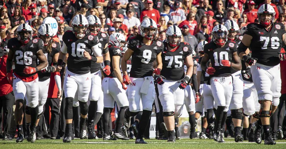 Noah Vedral leads the offense onto the field