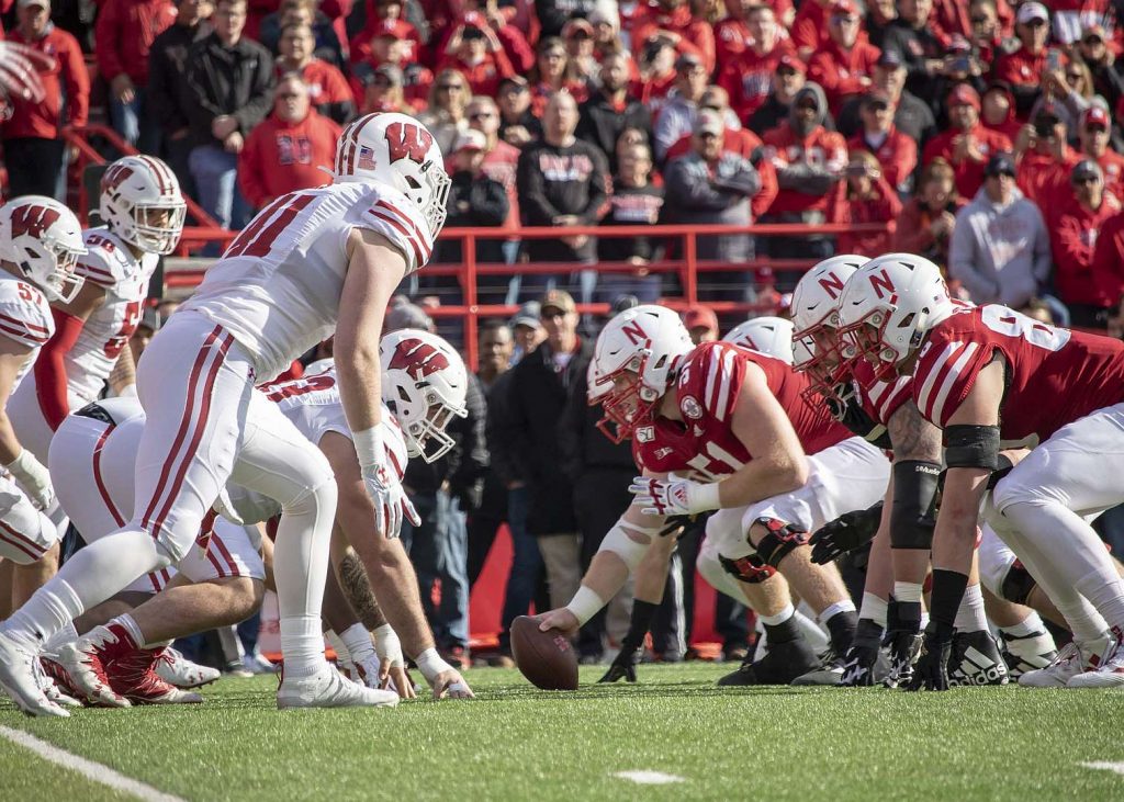 The Huskers' offensive line faces the Badgers' defense